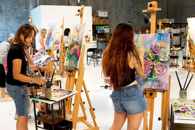 Classroom with artist working at easels