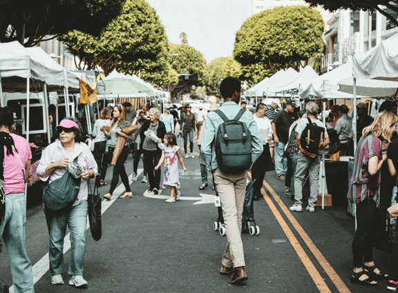 Local community event of people walking in market